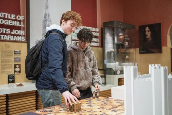 Two young men looking at an exhibit