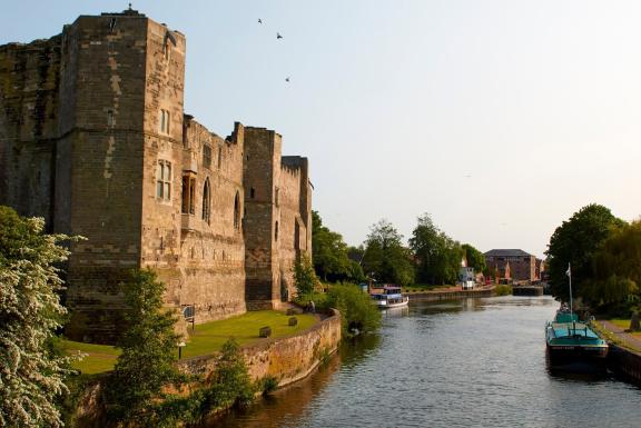 A view of Newark Castle with a moat