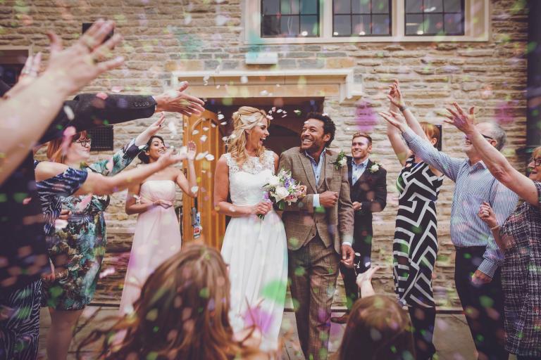 A large group of people celebrating a wedding 