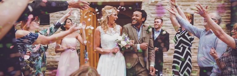 A large group of people celebrating a wedding 