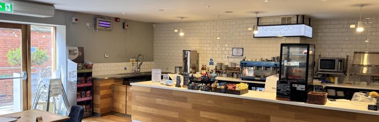 Tables, chairs and a counter in a cafe
